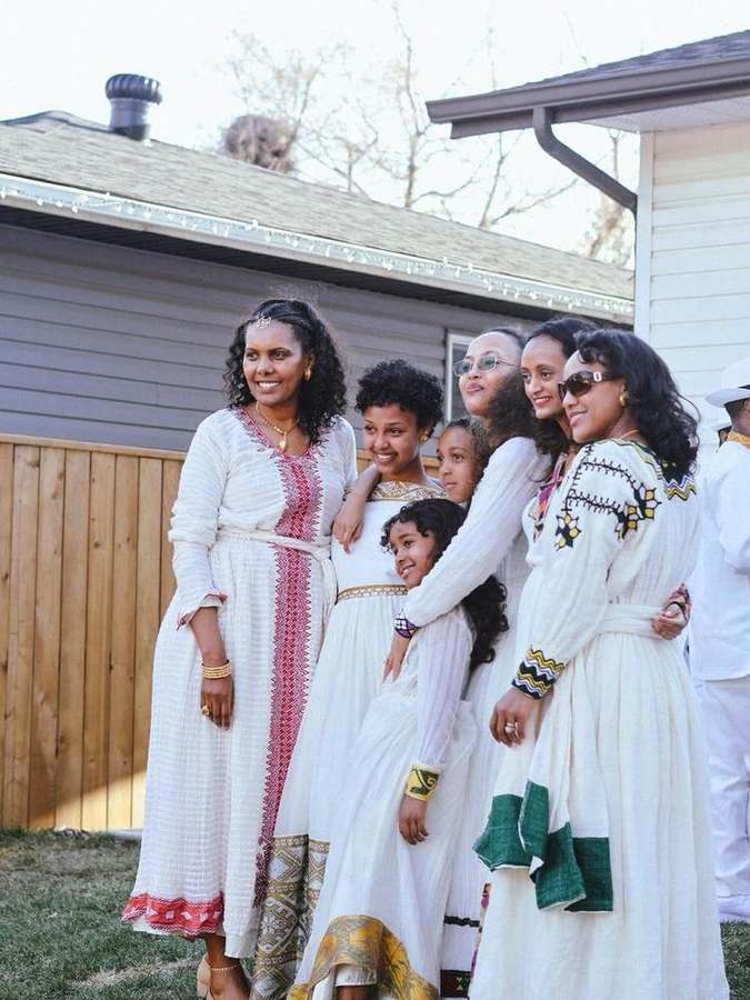 A group of women and girls posing together