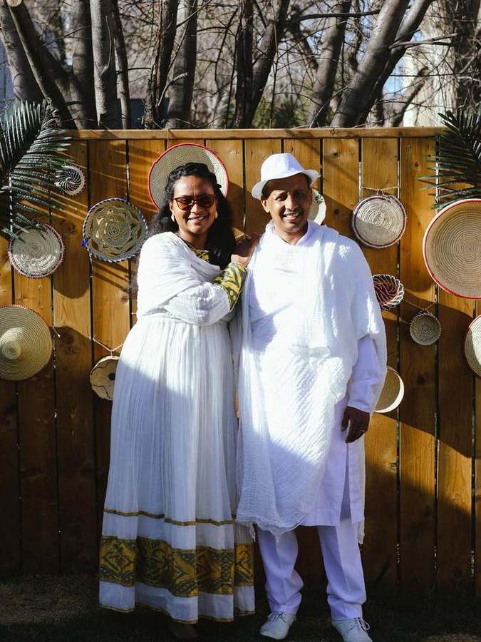 A couple standing together in front of the basket display
