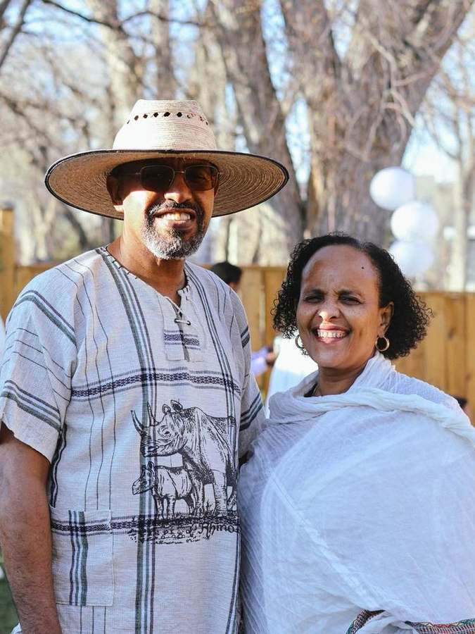 A couple smiling together outdoors