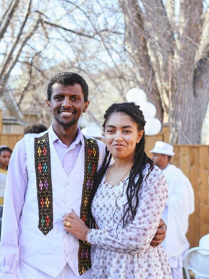 A couple smiling together outdoors