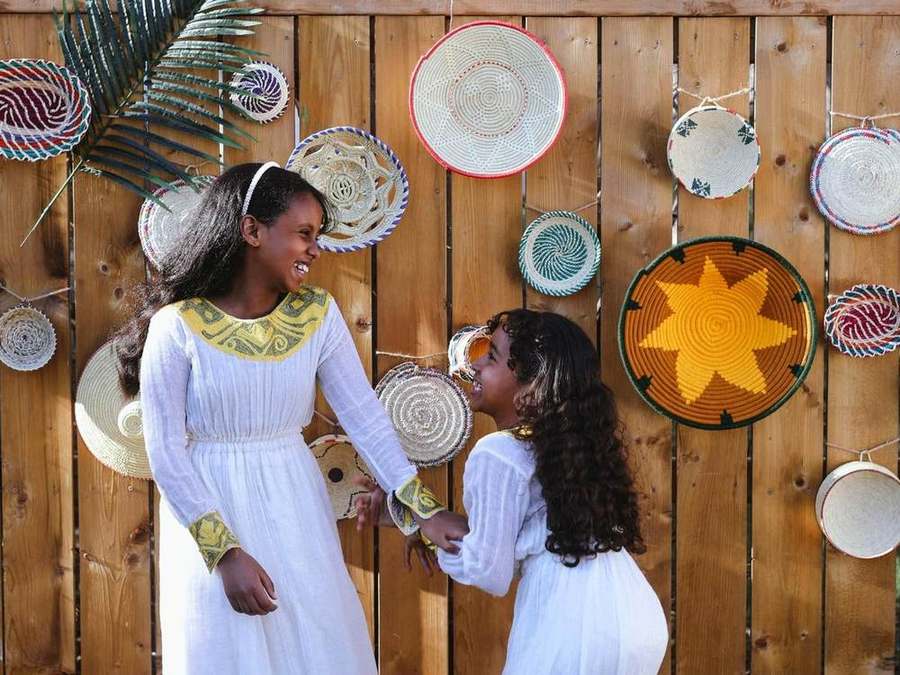 Two young girls laughing together