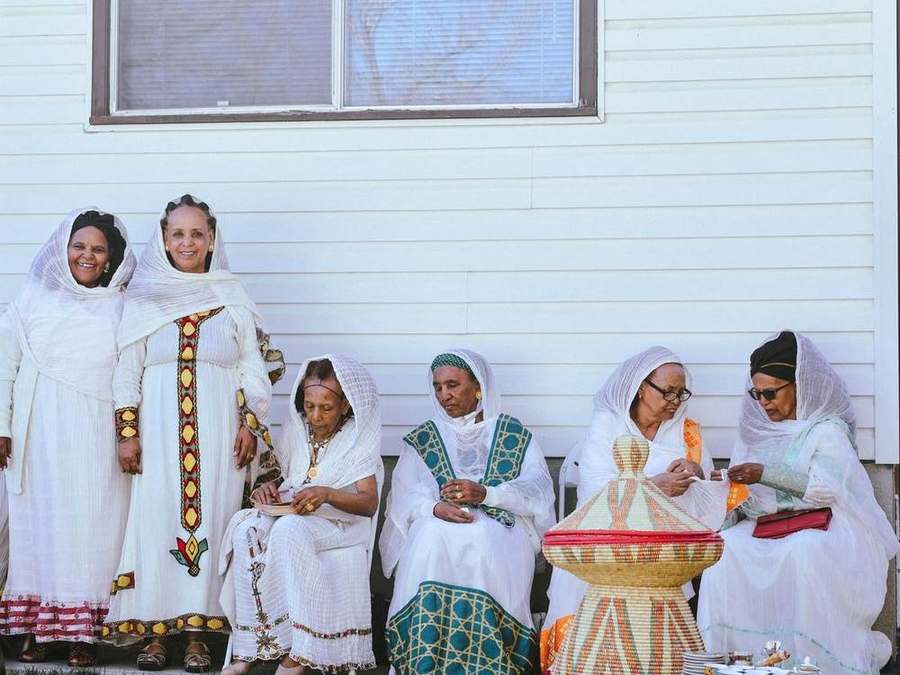 A group of elder women sitting together, chatting