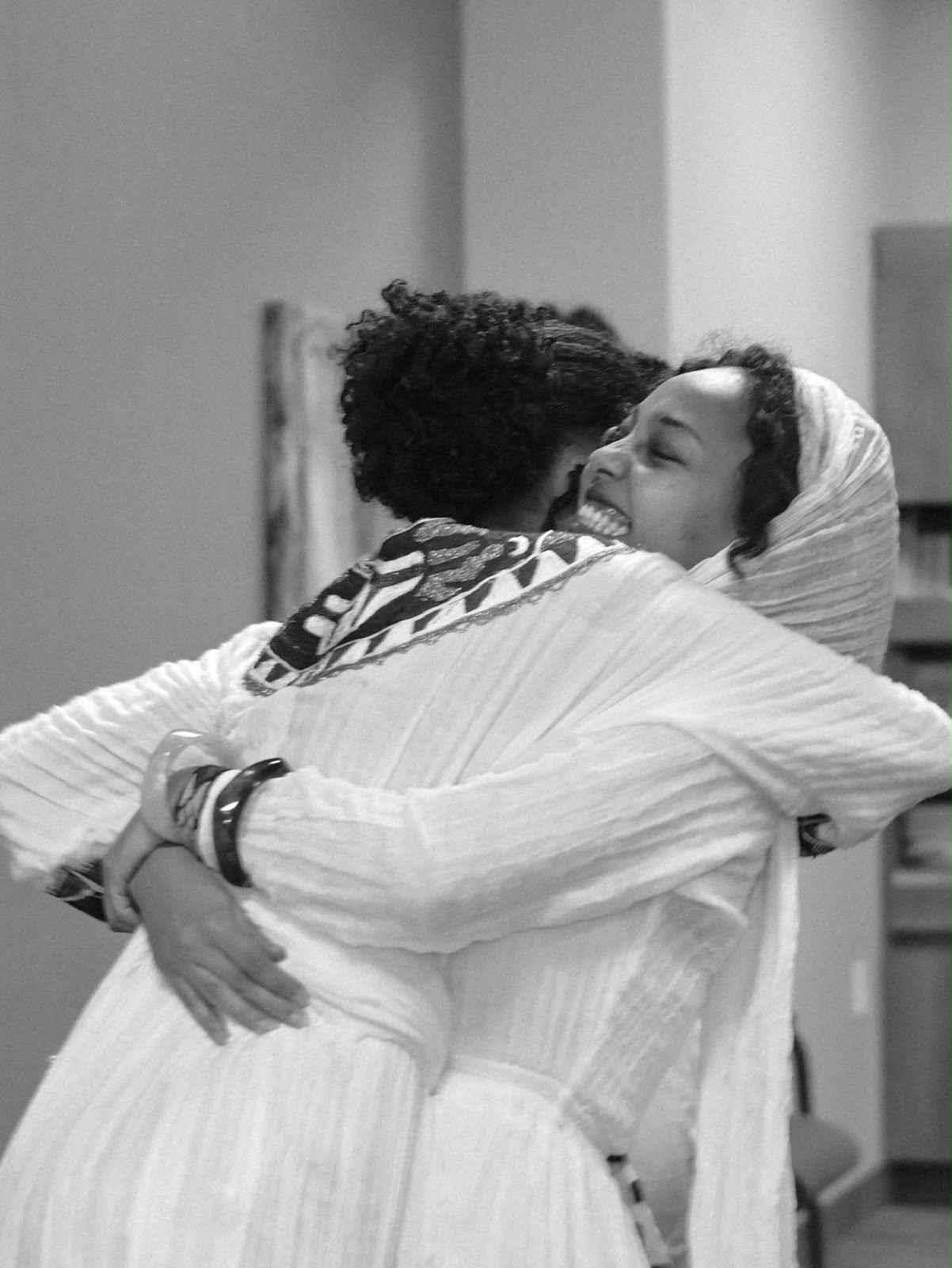 Two women embracing in a joyful hug