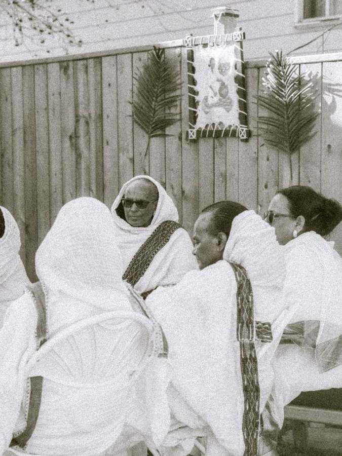 Elders chatting together by the fence